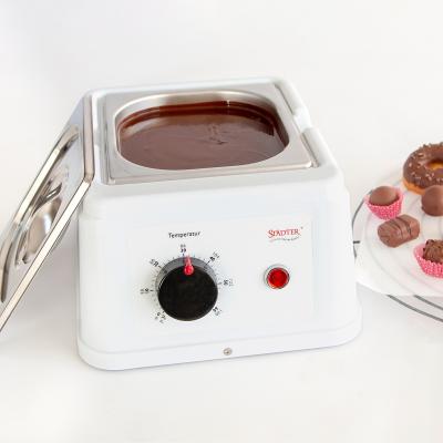 M�quina per fondre i temperar xocolata