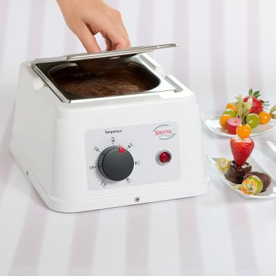 M�quina per fondre i temperar xocolata