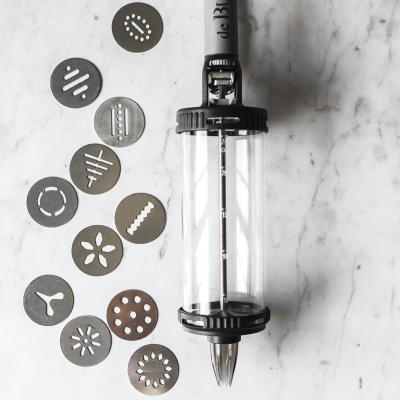 Le tube dosificador a pressi amb kit galetes