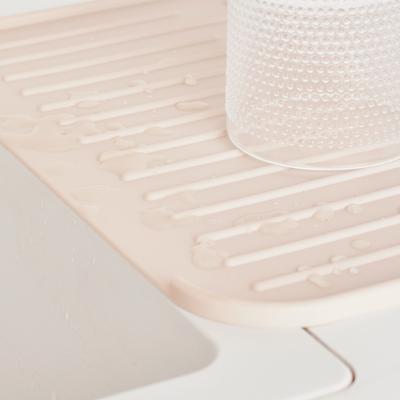 Escorreplats silicona amb sortida aigua soft beige