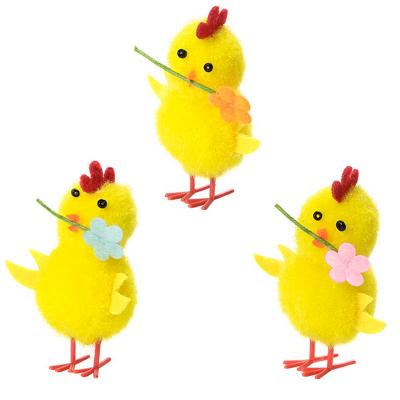 Pollito amarillo con flor Pascua 5 cm