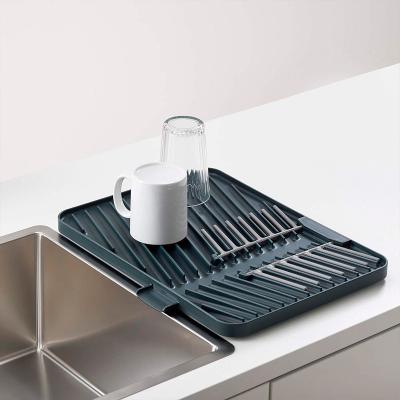 Base escurreplatos y vasos Flip Up gris