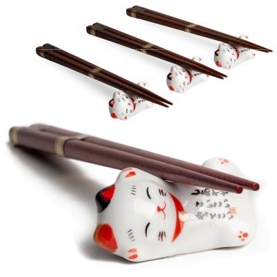 4 pares palillos con 4 soportes gato suerte