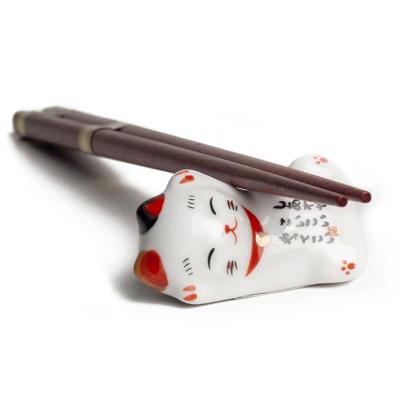 4 pares palillos con 4 soportes gato suerte